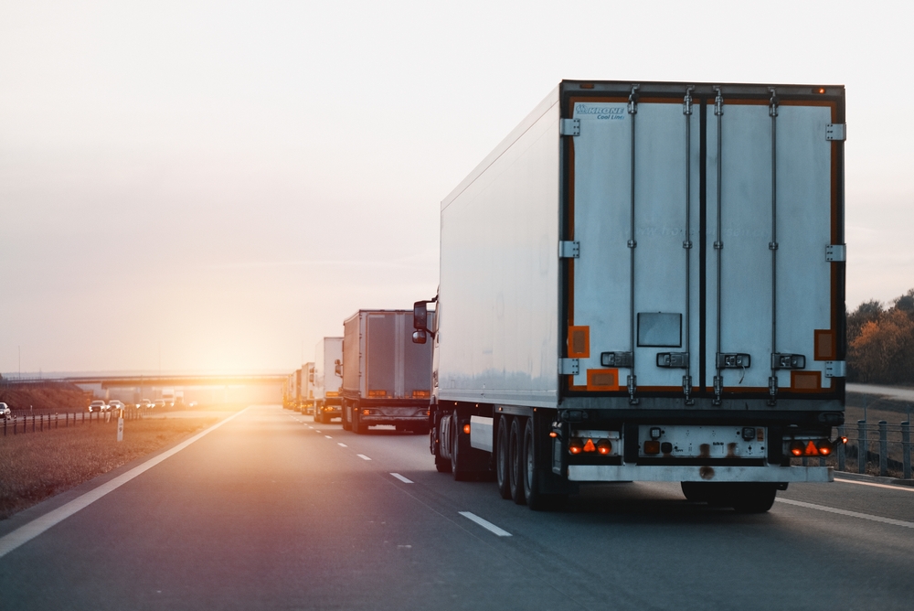 Modern,White,Semi-trailer,Trucks,On,The,Highway,Driving,In,The